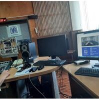 desktop with mikes and monitors