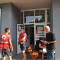 volunteers standing at front door