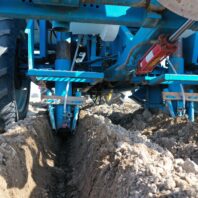 A picture of an sprayer used at planting for in-furrow treatments.