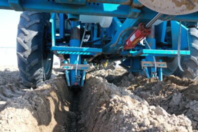 A picture of an sprayer used at planting for in-furrow treatments.