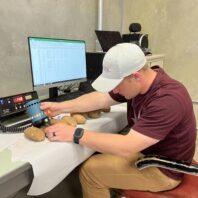A picture of a student using a photovolt machine.