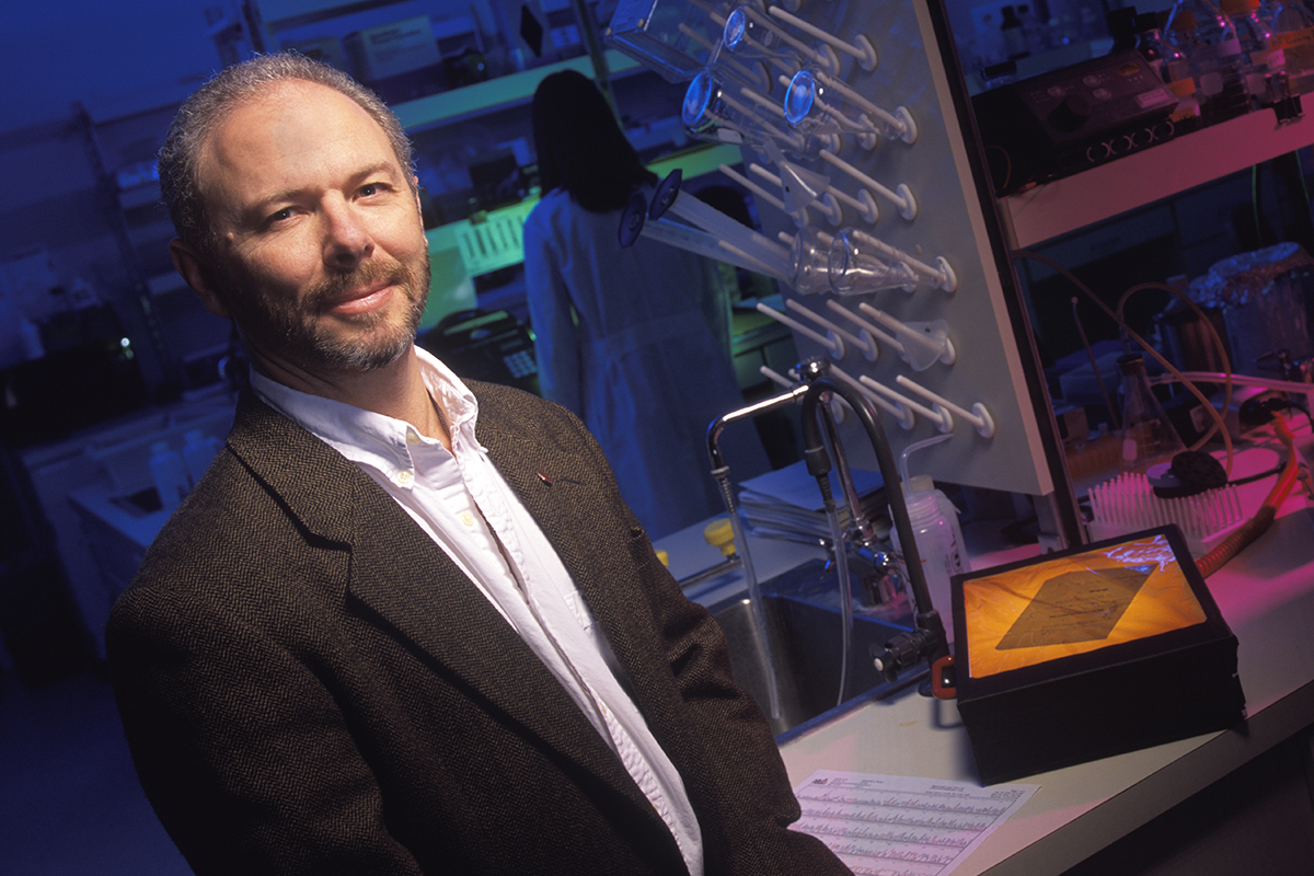 Michael Skinner standing in laboratory.