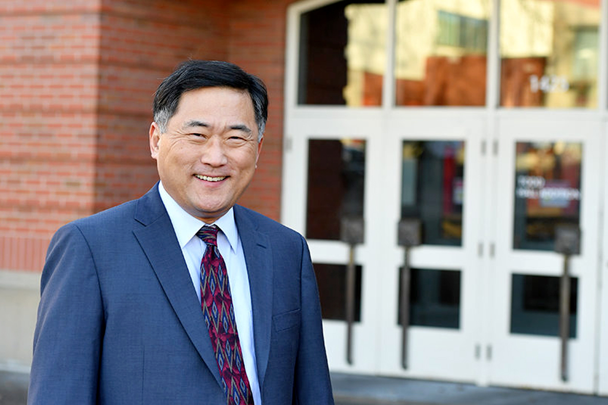 Ahn standing in front of Carson College of Business.