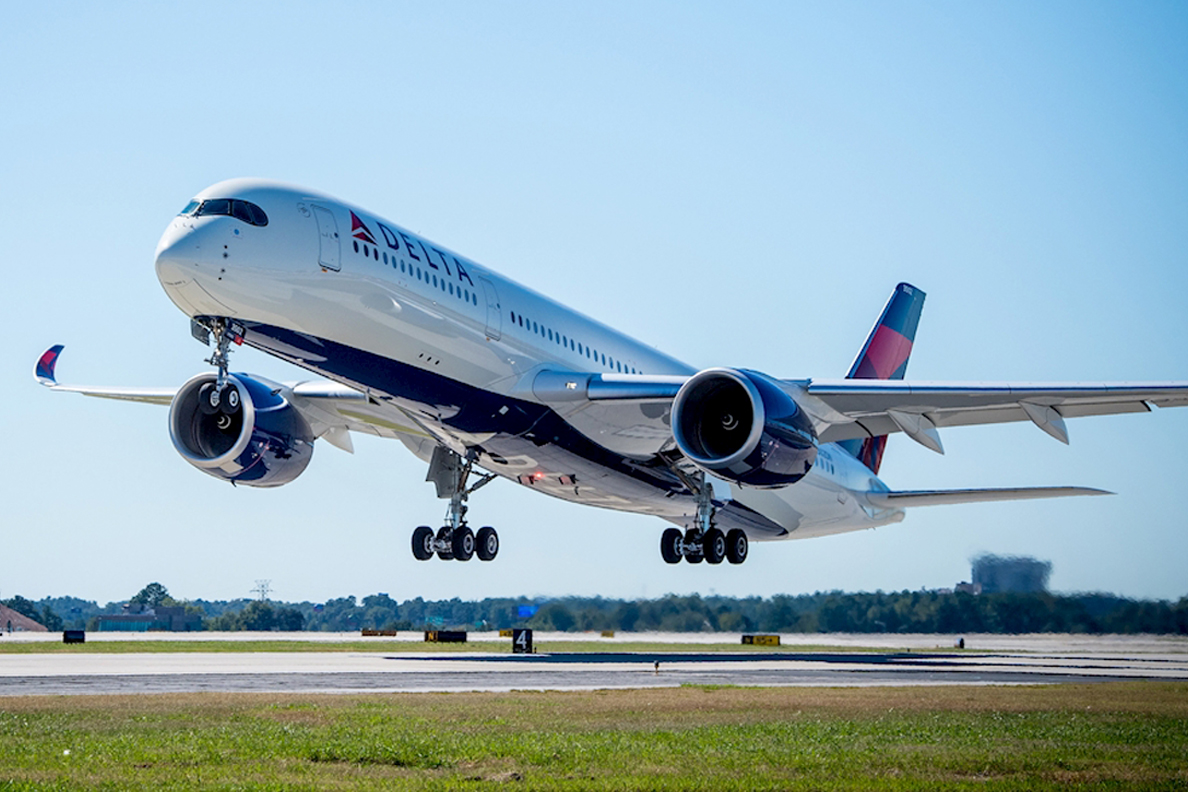 Delta airliner preparing to land on runway.