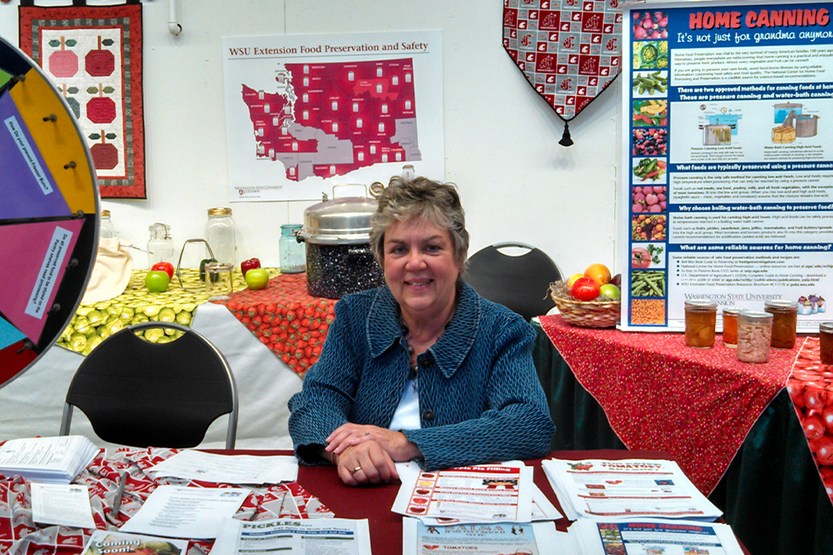 Margaret Viebrock surrounded by WSU Extension education materials.