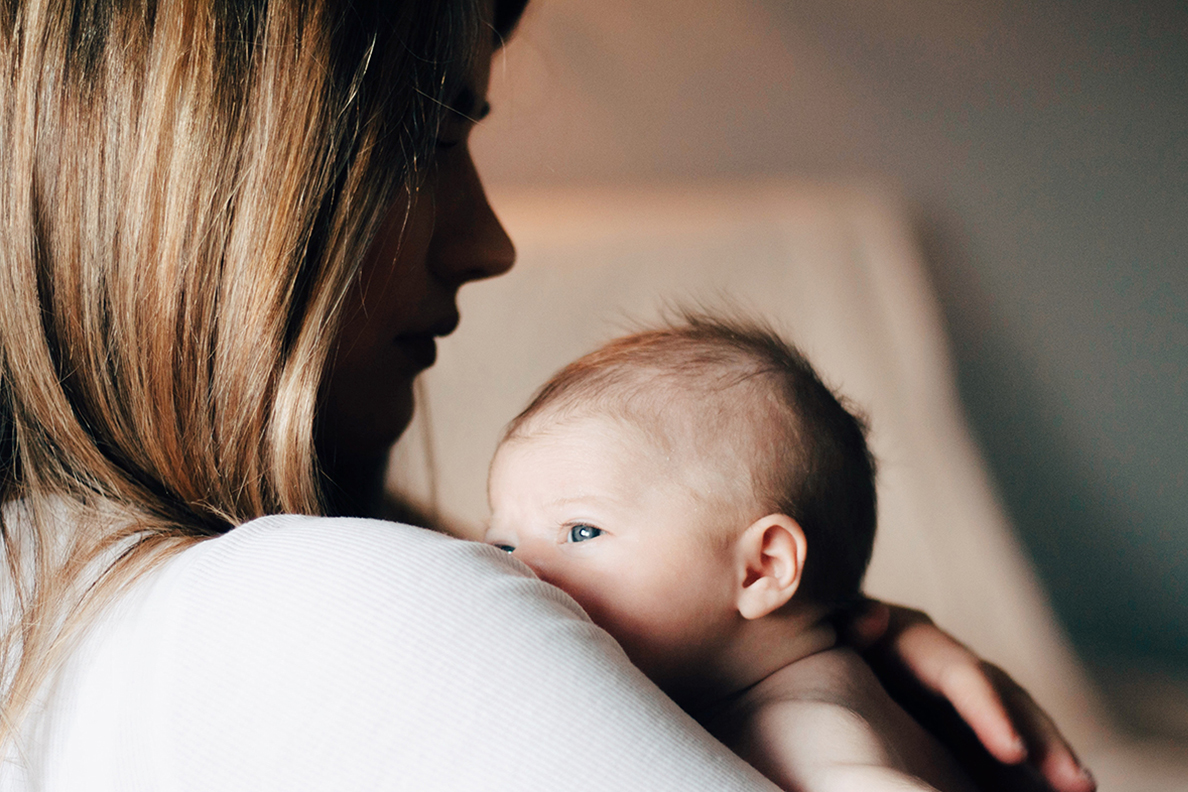 A mother holding her baby