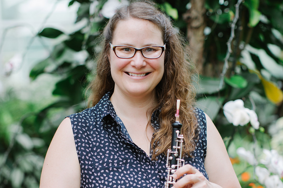 Keri McCarthy standing with a musical instrument