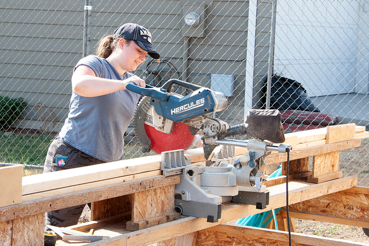 An architecture student works on a Habitat for Humanity home.