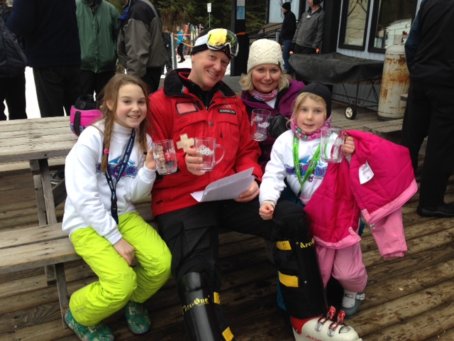 Daniel Voltz and his wife and daughters holding their first place trophies.