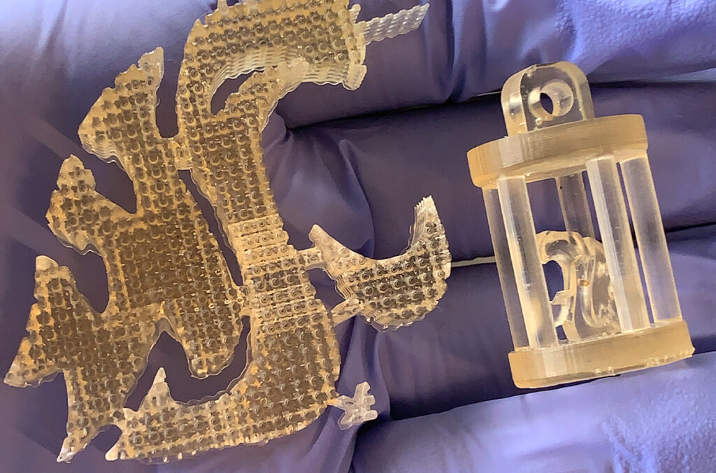 Closeup of two 3D-printed figurines.