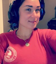 A WSU Global Campus student wearing headphones.