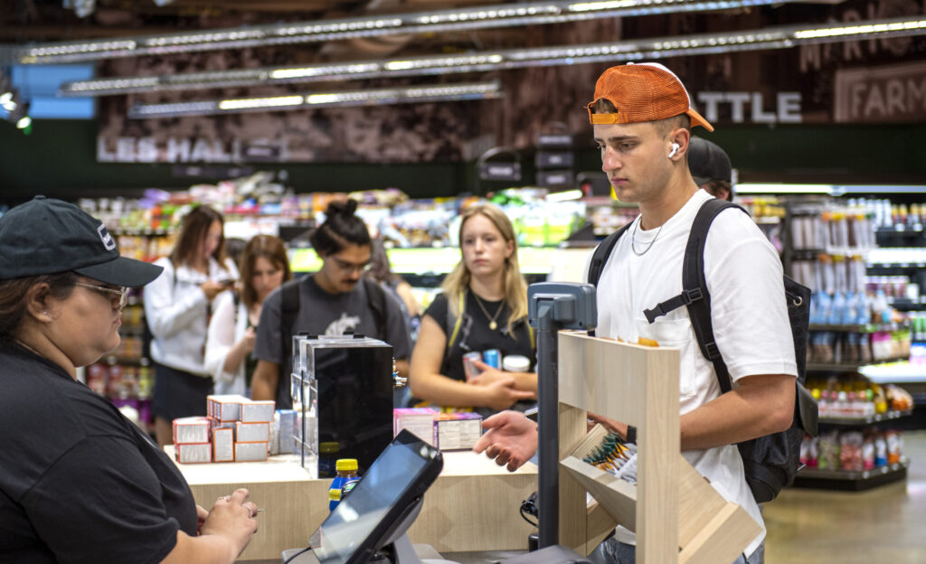 A line of students in a convenience store on the WSU Pullman campus.