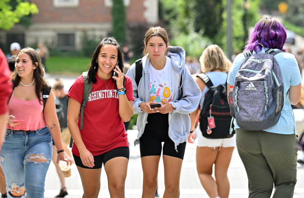 A student stops and stares at a photographer on the WSU Pullman campus.