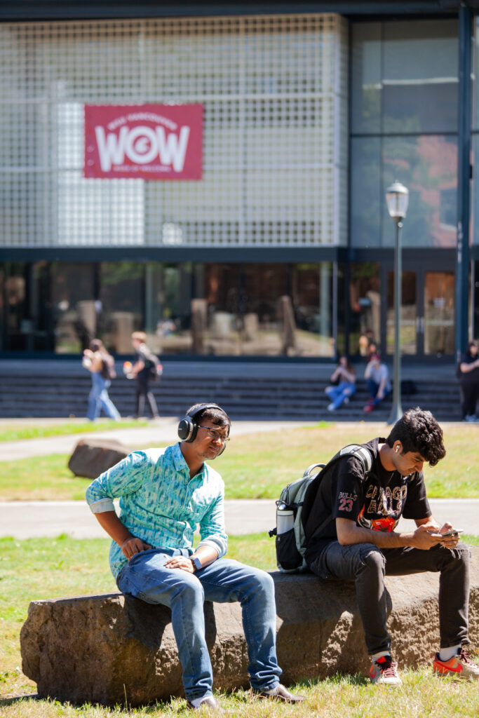 Students sitting outside on the WSU Vancouver campus.