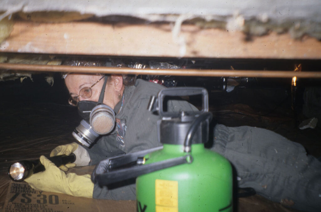 Laurel Hansen has often been witnessed wearing coveralls and boots, implementing her research in the field (Photo courtesy Laurel Hansen).