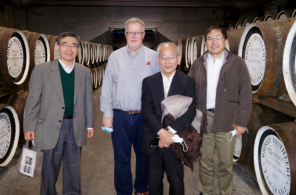 Collins poses for a picture in the barrel room at the Suntory Yamazaki Distillery.