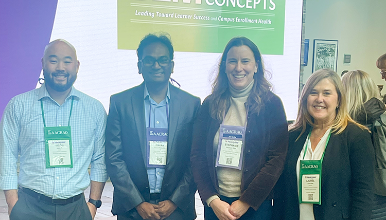 Four WSU employees while at the Strategic Enrollment Management conference