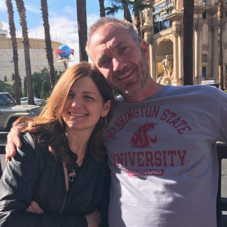 Woman and man wearing WSU shirt