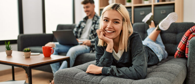 Photo of young woman relaxing on couch