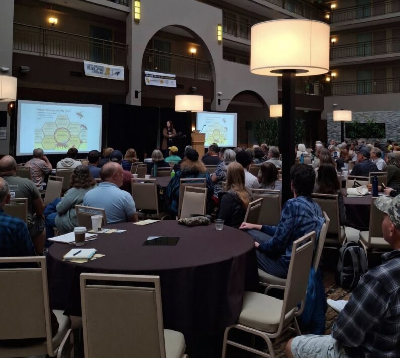 Dr. Taylor Reams presenting about honey bee nutrition at 2024 WASBA Conference.