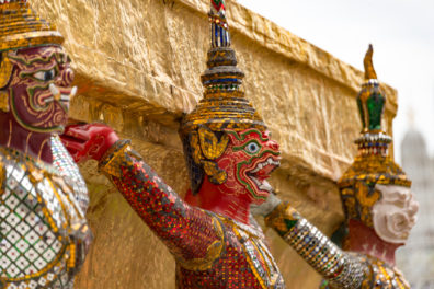 Close-up of statue face at a temple or palace in Bangkok, Thailand.