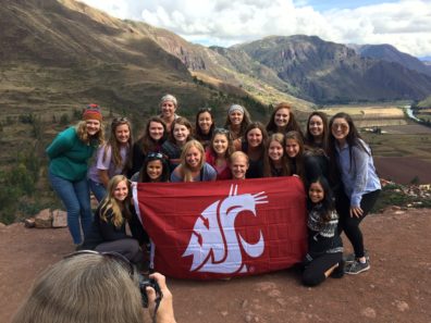 Group of WSU Students with a Coug flag in Peru