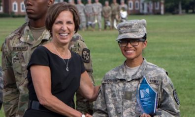 Photo of Cadet Madriaga shaking hands with a representative of Norton Healthcare.