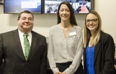 Robert Playo, left, with Clinical Assistant Professor Dana Dermody, center, and Megan Weese, right, at the presentation of DNP final projects.