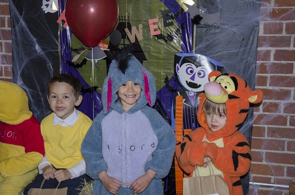 three kids in costume