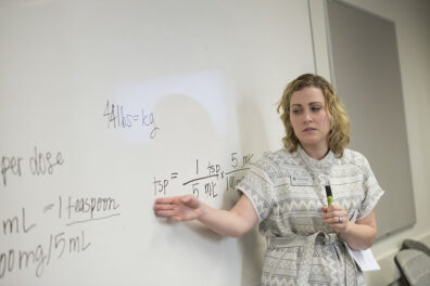 PhD student teaching a class