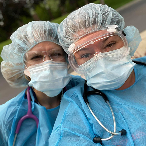 Two female DNPs dressed in full PPE