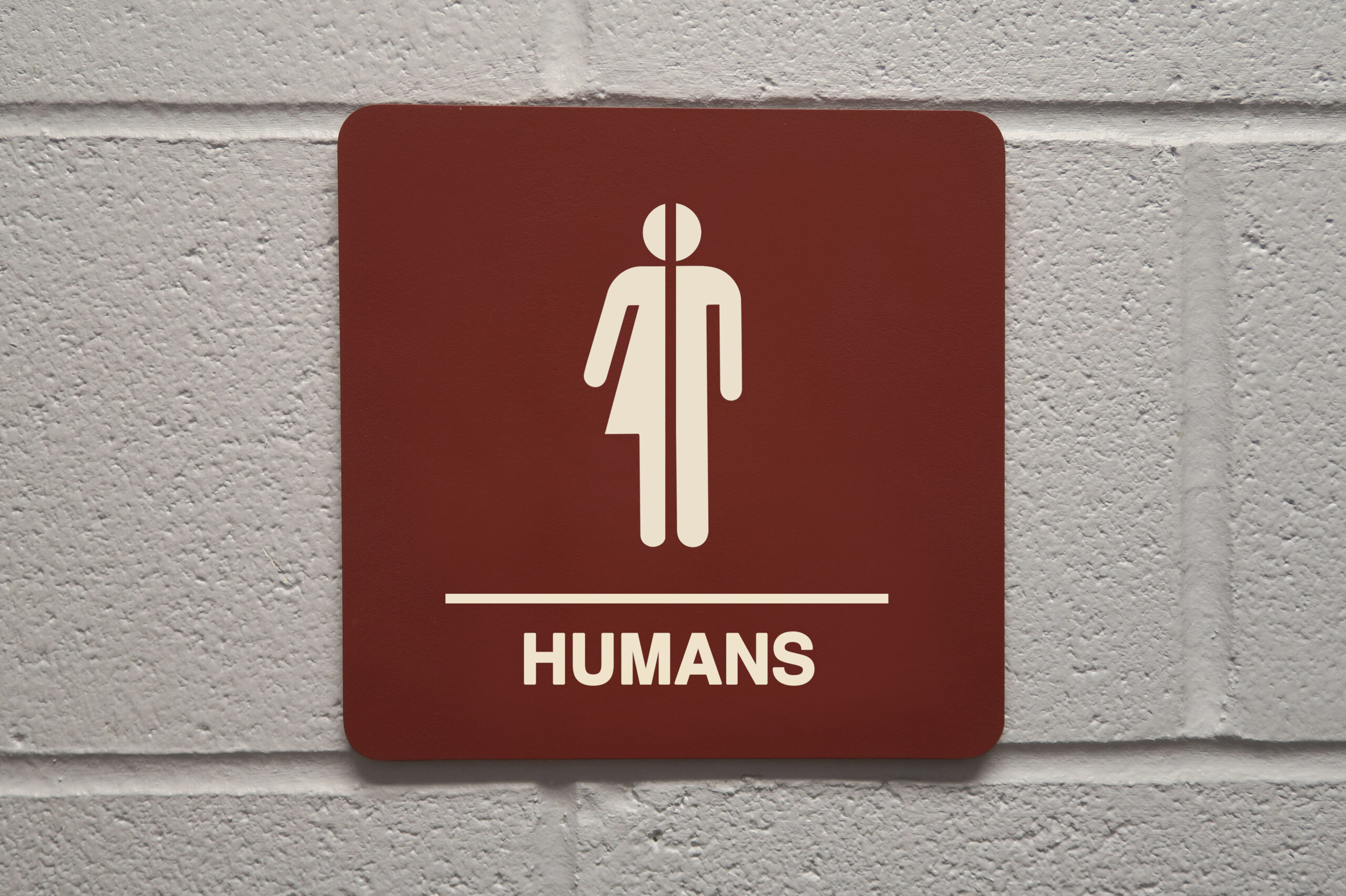 Close up of gender neutral restroom sign