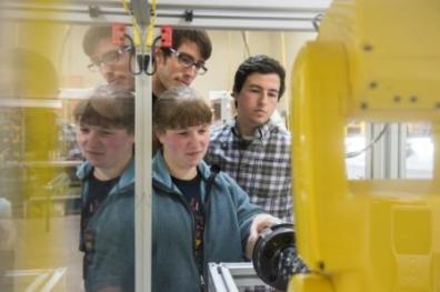 Students David Wyrick, Krista Edwards and Gage Pepin work on Boeing project.