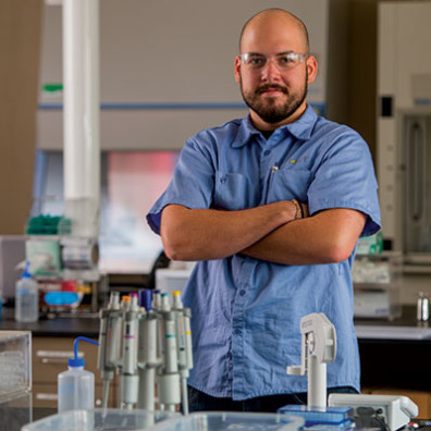 ARCS Scholar Nick Pokorynski posing in his lab
