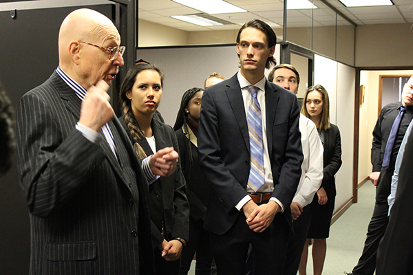 Judge speaking with students.