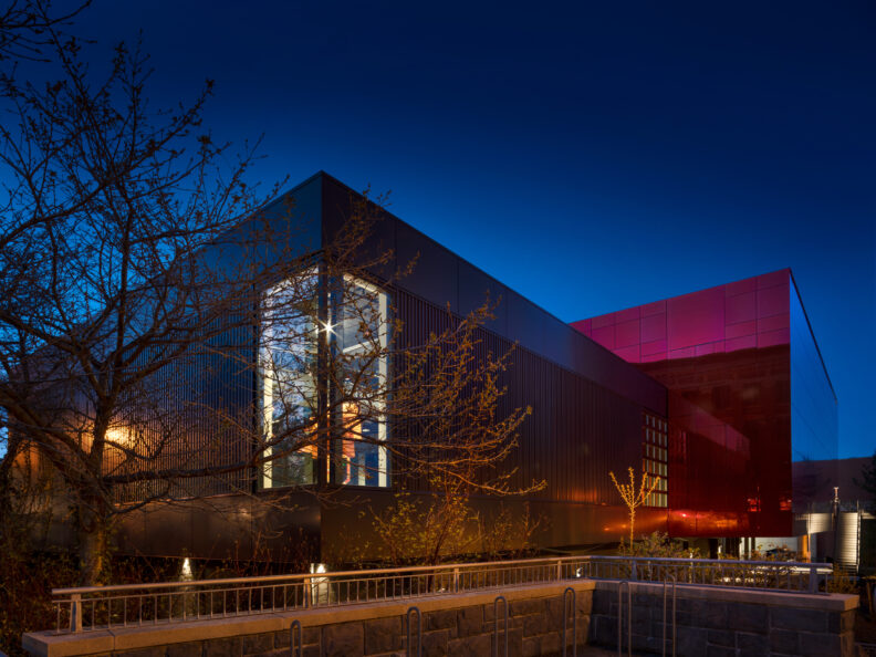 Image of the back of the museum building at night.
