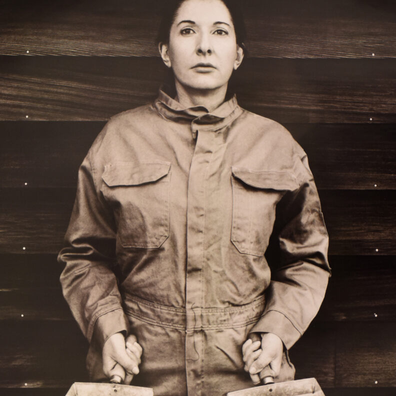 An image still of Marina Abramovich in a jumpsuit.