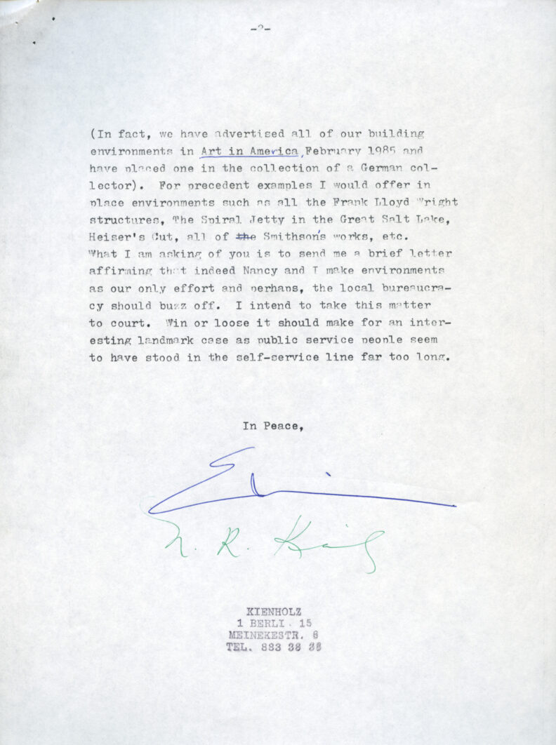 Image of a typed letter, signed in blue ink.