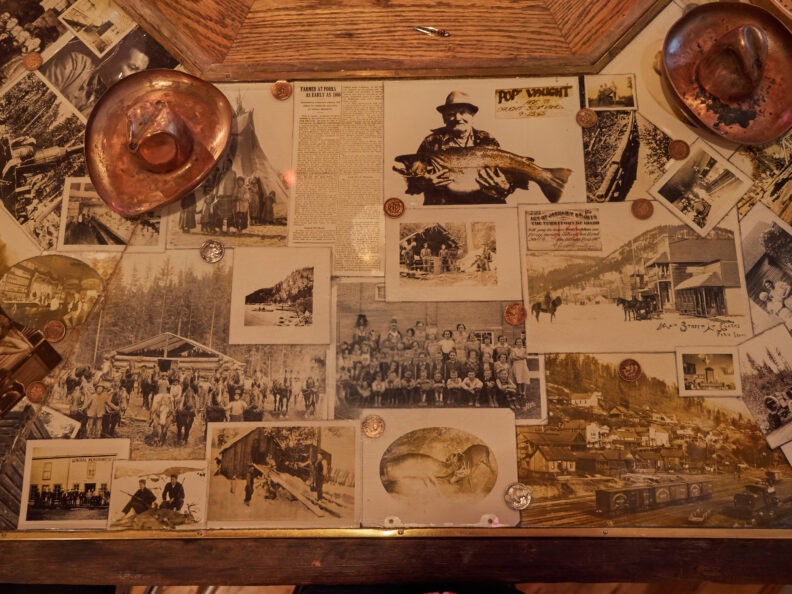 Photo of an art installation of a bar countertop with photos. 