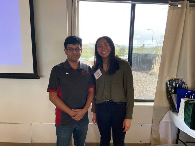 Natalie stands next to Dr. Ganjyal.