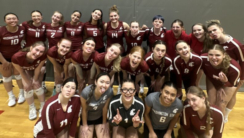 A group of students in volleyball uniform. Natalie stands in the top left.