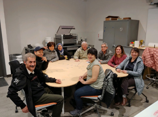Photo: Focus groups sits at prototype table.