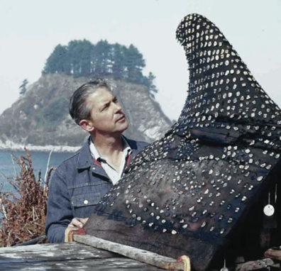 In this undated WSU photo, Daugherty stands by the effigy of a whale fin unearthed at the Ozette site.