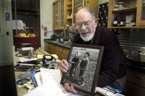 Don Matteson holds a 1937 photo of himself and the girl who became his wife, Marianna, in his lab at WSU’s Fulmer Hall. (Photo by Christopher Anderson/ Spokesman Review 2008. Read the accompanying story)