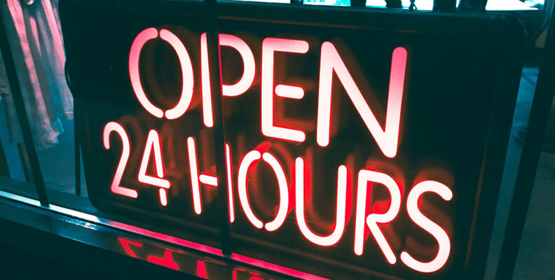 Photo of lighted "Open 24 hours" sign
