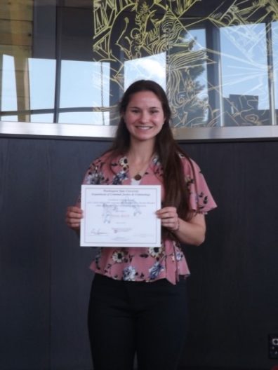 Emma Smith holds her award certificate.