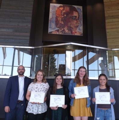 Dr. David Makin stands with students Emily Barlett, Samantha Bill, Mackenzie Jeter, & Ivania Ordonez, who are displaying their award certificates..