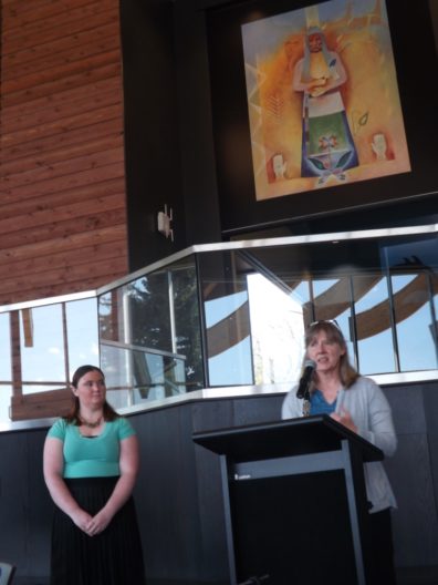 Dr. Faith Lutze addresses the audience while Courtney Bagdon looks on..