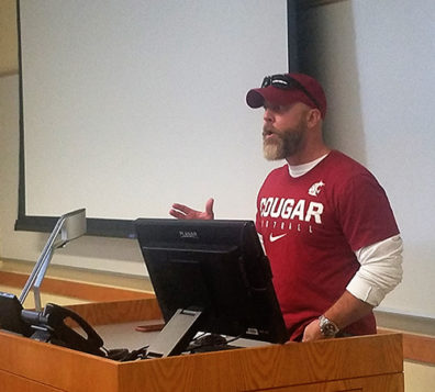 WSU Criminal Justice alum Special Agent Craig A. Bowling at the lectern talking to a class.