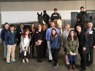 Alumni Drs. Amber Morczek and Wendy Koslicki (bottom right) at the Baltimore Police tour.